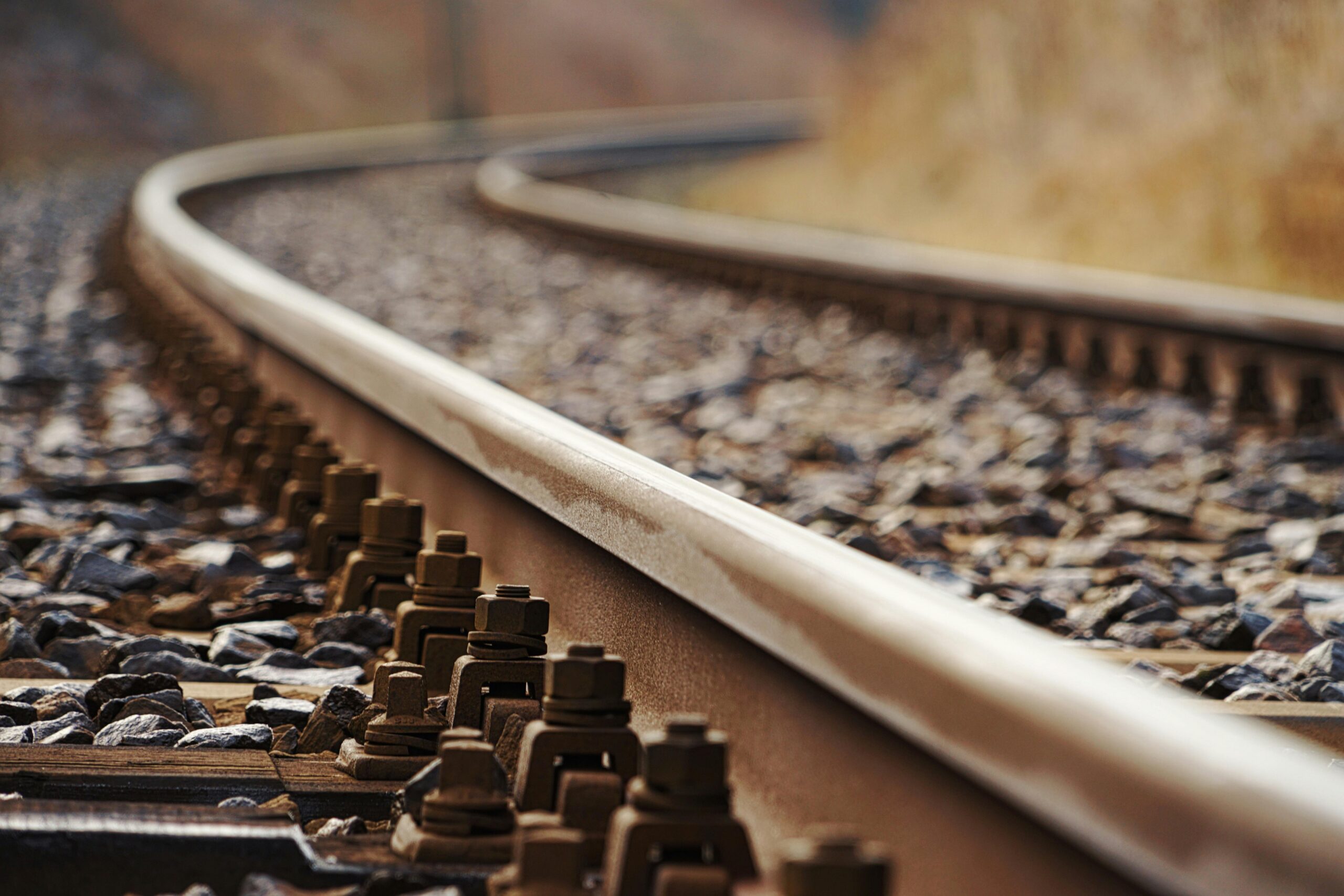 Detailed shot of a rusty railway track, showcasing close-up textures and metallic elements.